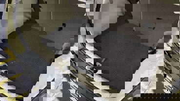 Vendbar bagagerumsmåtte